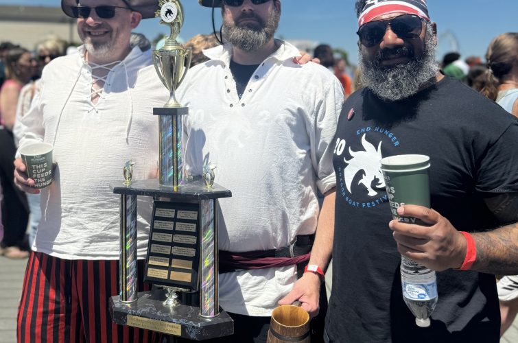 The Owner Pose with the Trophy
